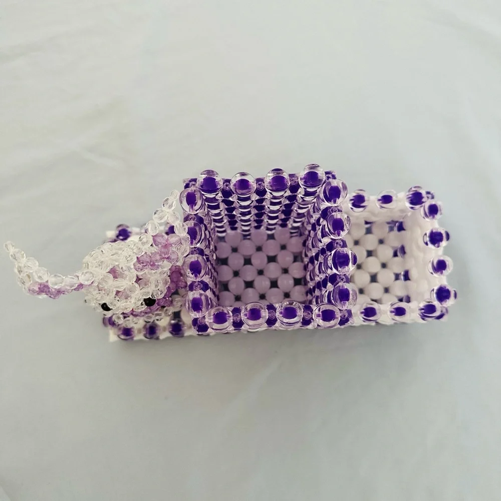 A cute little bunny pencil holder handmade beads in shades